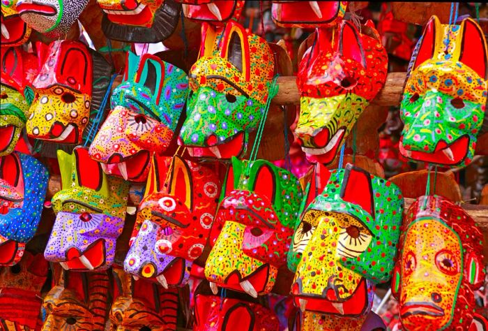 Vibrant wooden animal masks decorate a wall at the Chichicastenango Market