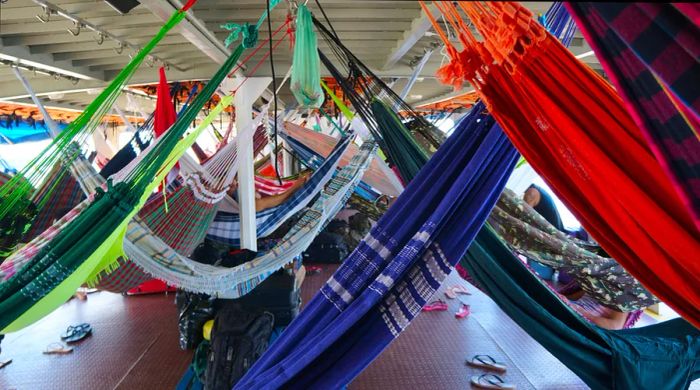 Vibrant hammocks set up on a ferry traveling from Macapa to Belem