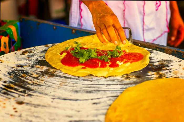 A chef prepares a mole amarillo (yellow mole) quesadilla in Mexico.