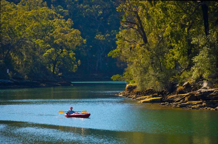 Canoeing near Audley in Royal National Park, New South Wales, Australia