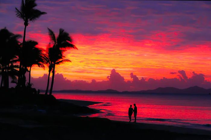 A couple enjoys the sunset on Denarau Island in Fiji. Getty Images