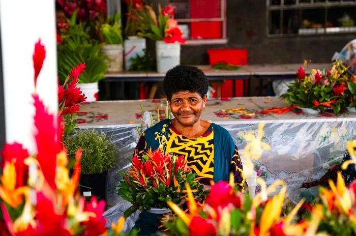 A flower vendor in the bustling commercial area of Suva, Fiji's capital. Alipate Laveti for Dinogo Planet