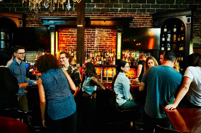 A group of friends enjoying drinks at a bustling bar in Washington state, USA