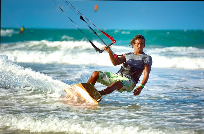 A kitesurfer harnesses the wind off Brazil's coastline