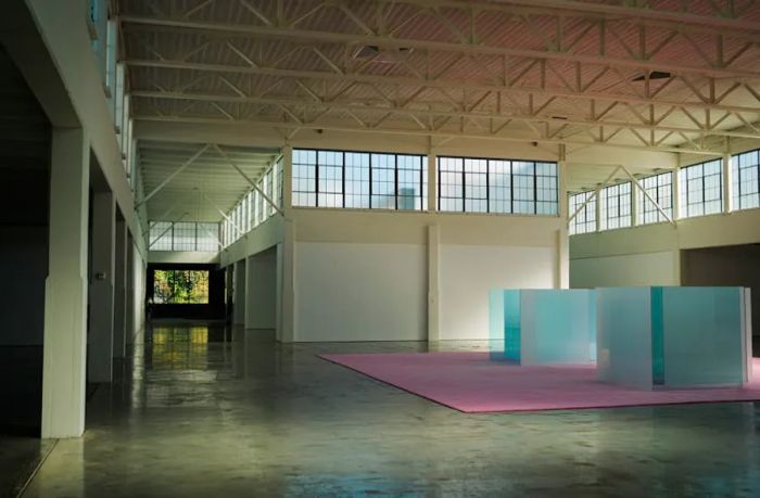 The inside of a spacious factory transformed into a contemporary art gallery