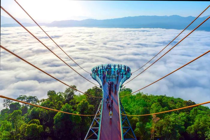 Visitors at Skywalk Ayerweng during dawn, Yala Province, Thailand