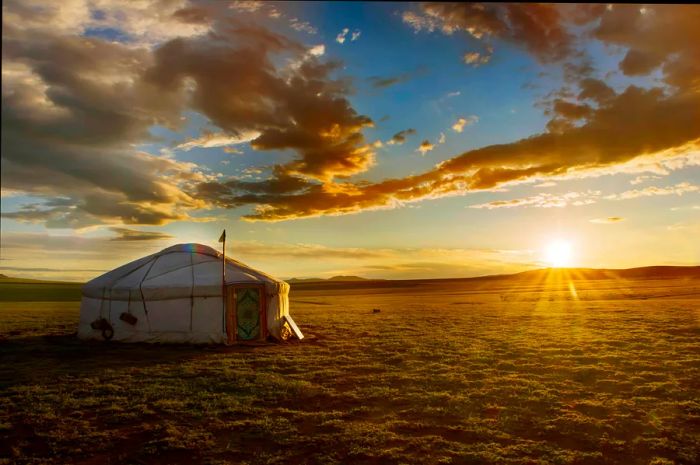 A beautiful sunrise over a ger in the Mongolian countryside