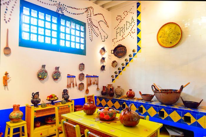 Vibrant pottery and tiles adorn Casa Azul, the beloved home of Frida Kahlo in Mexico City.