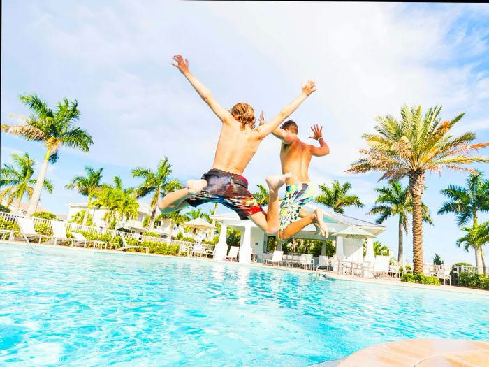 Boys diving into a swimming pool at a Florida resort