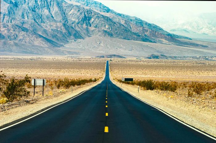 A road in Death Valley stretching toward the horizon