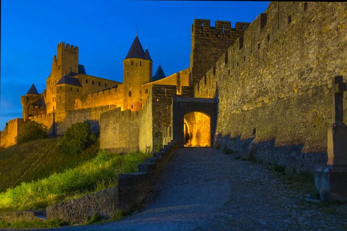 The medieval fortress and walled city of Carcassonne, located in southwest France, was founded by the Visigoths in the 5th century. Restored in 1853, it is now recognized as a UNESCO World Heritage Site.