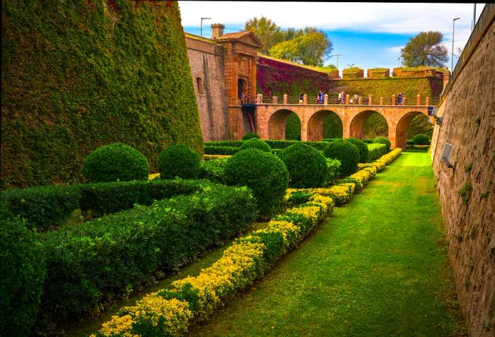 Discover the vibrant gardens surrounding Castell de Montjuïc in spring. Shutterstock