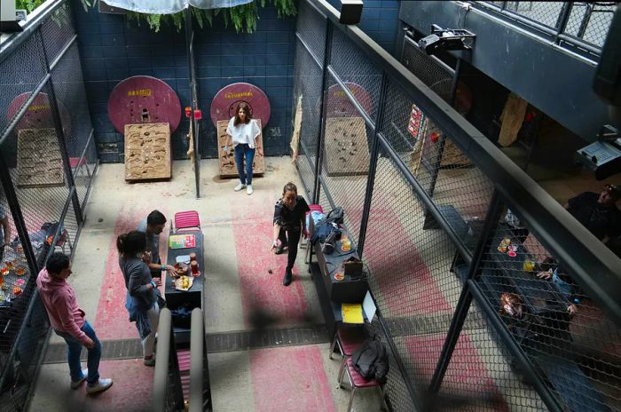 An overview of friends enjoying a game of Tejo in Bogotá, Colombia