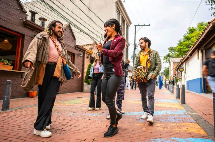 Friends dancing in the streets of Bogotá, Colombia