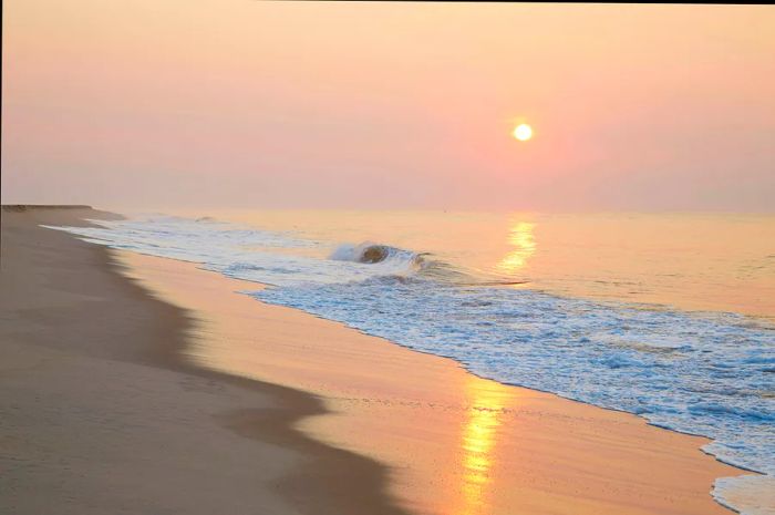 The sunrise casts its glow over the Atlantic, viewed from Sagg Main Beach in Sagaponack.