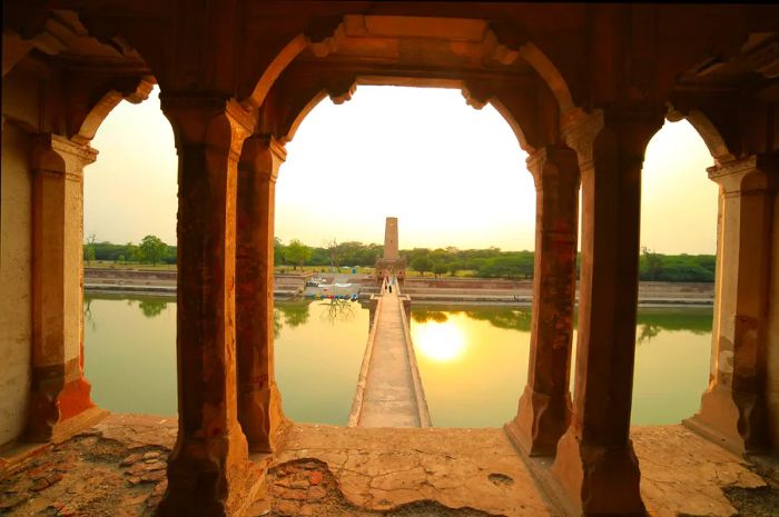 A scenic view over the water from the pavilion at Hiran Minar, Pakistan