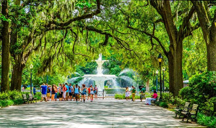 Families enjoying a stroll through Forsyth Park in Savannah, Georgia