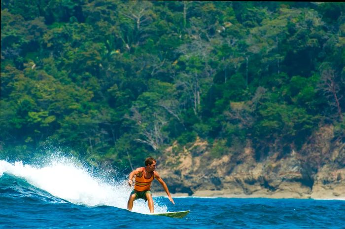 A young man enjoying surfing in Costa Rica