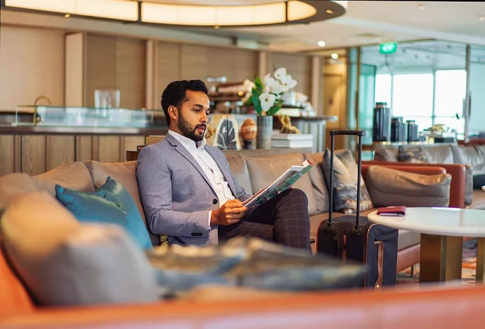 Business traveler - Indian businessman relaxing in an airport lounge