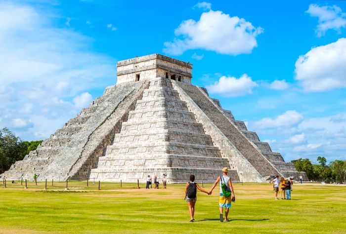 A stunning view of the Chichen Itza archaeological site in Yucatan, Mexico, on a bright, sunny day.