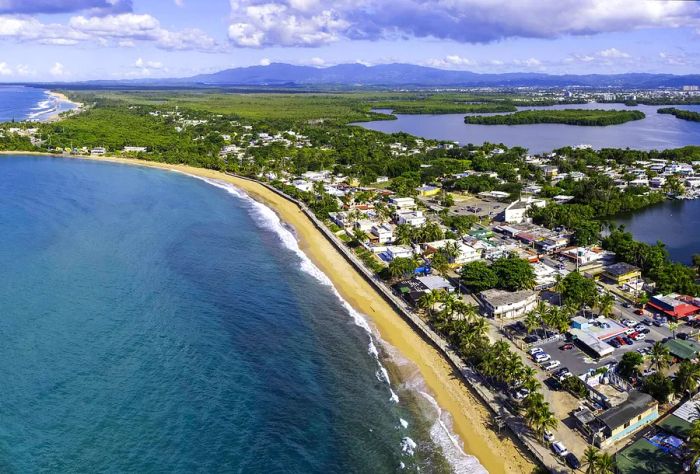 Bird's-eye view of a Caribbean beach and village in Puerto Rico