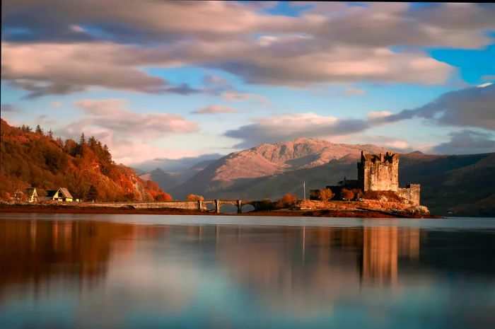 Dramatic sunset at the stunning Eilean Donan Castle in Scotland, UK