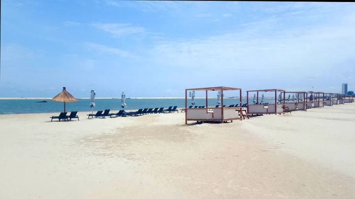 Cabanas and umbrella seating along the waterfront at Landmark Beach in Lagos, Nigeria