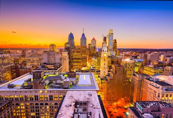 A stunning skyline featuring illuminated skyscrapers reaching into the sky with vibrant shades of yellow and blue.