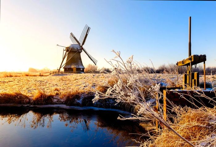 The Wedelfelder mill illuminated by the sunrise on a clear, frosty winter morning in January.