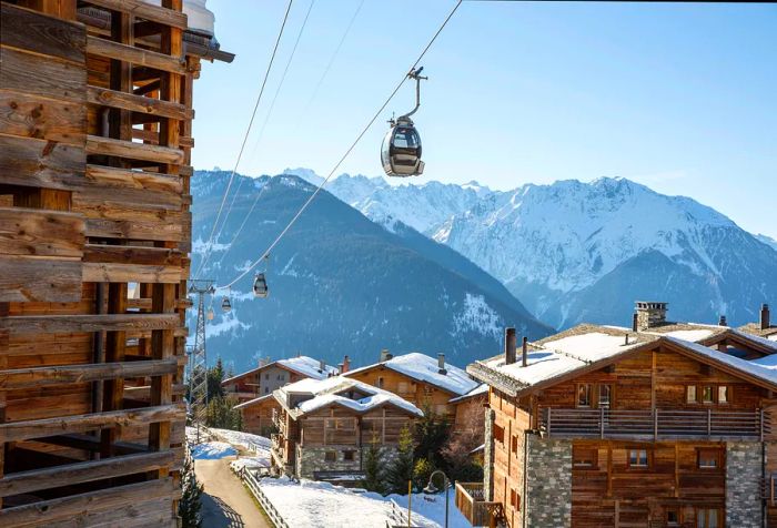 A network of cable cars glides above the rooftops of quaint wooden homes.