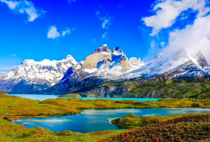 Snow-capped mountains and a serene lake on a sunny spring day in Patagonia, Argentina