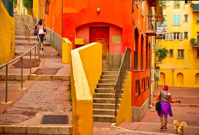 A lively street featuring stairs lined with a delightful mix of colorful, vintage buildings.