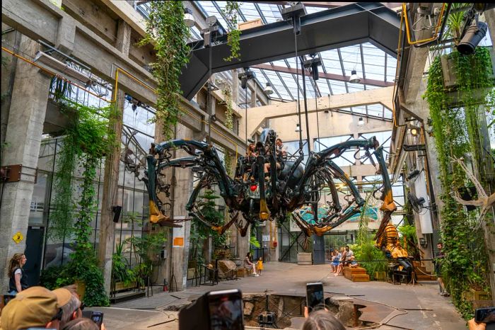 A colossal spider resides in the steampunk-inspired Machine Gallery at the Machines of the Isle of Nantes.