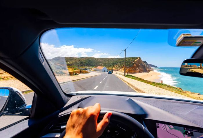 dest_portugal_theme_beach_car_gettyimages-1397617471_universal_within-usage-period_83067