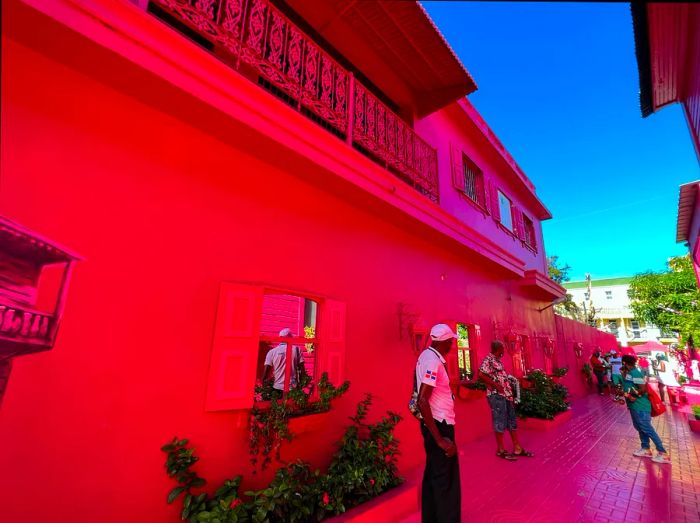 People enjoying and mingling on the Pink Street in Puerto Plata