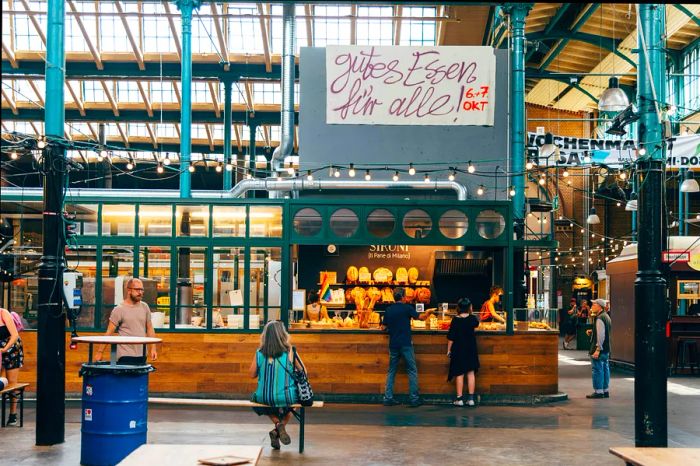 A view of Markthalle Neun, a historic market known for its street food in Berlin's Kreuzberg district.