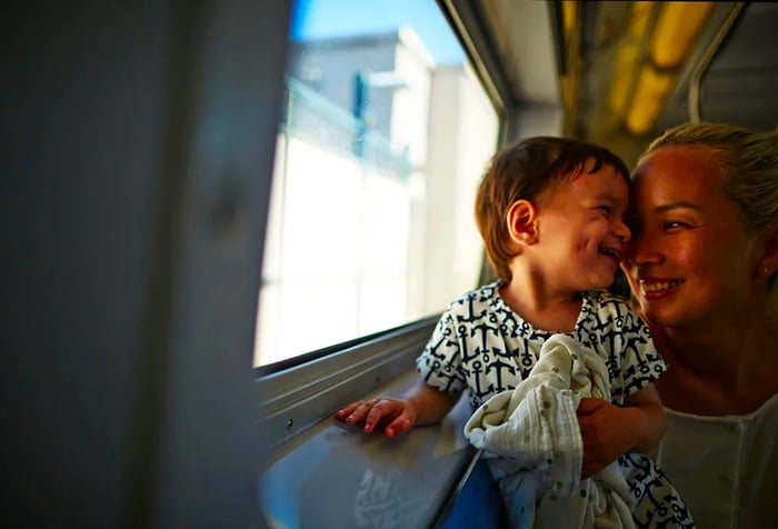 A joyful mother and son sharing a moment together.