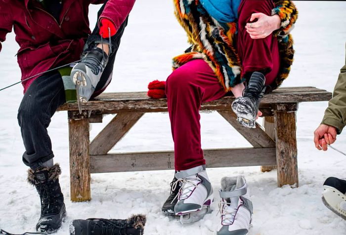 As winter approaches, a transgender teen prepares for ice skating by the lake, surrounded by laughter and support from their chosen family, creating an atmosphere of excitement and togetherness.