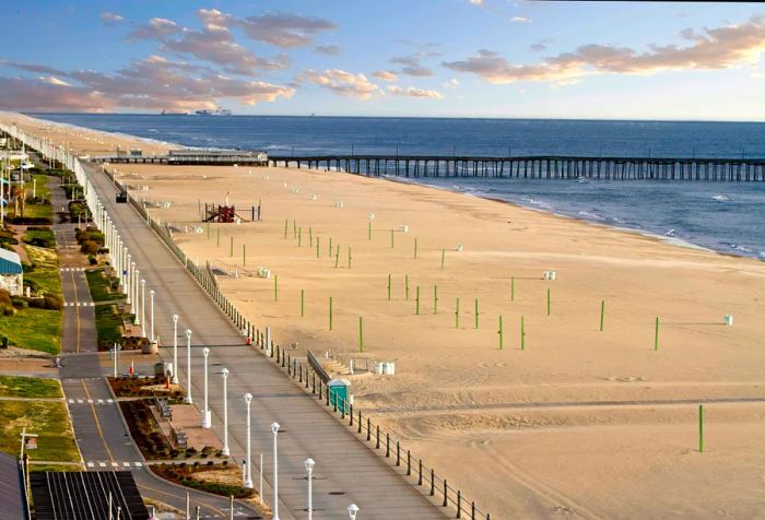 Virginia Beach and its boardwalk bathed in the soft light of dawn.