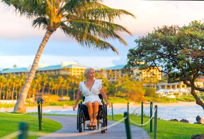 A confident woman in a wheelchair enjoying her vacation in Hawaii, USA