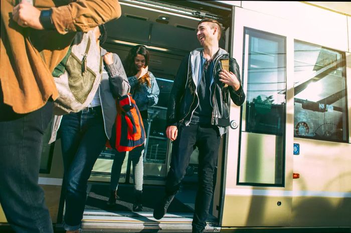 Passengers boarding a light rail train in Seattle