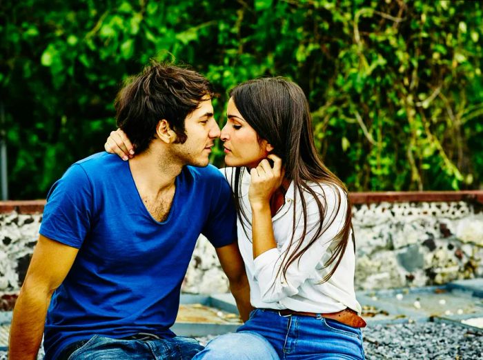 A couple sharing a moment before a kiss on a rooftop terrace in Mexico City