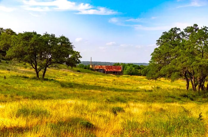 Texas ranch featuring rolling hills in Wimberley, Texas. An expansive ranch showcasing the Texas Hill Country landscape.