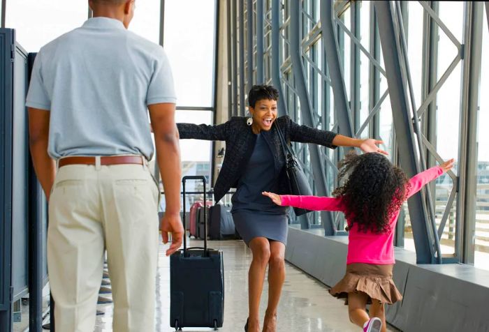 A joyful mother welcoming her daughter upon arrival at the airport.