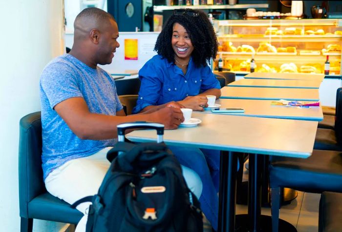 Image of a couple enjoying their time at a cafe, representing Brazilian culture.