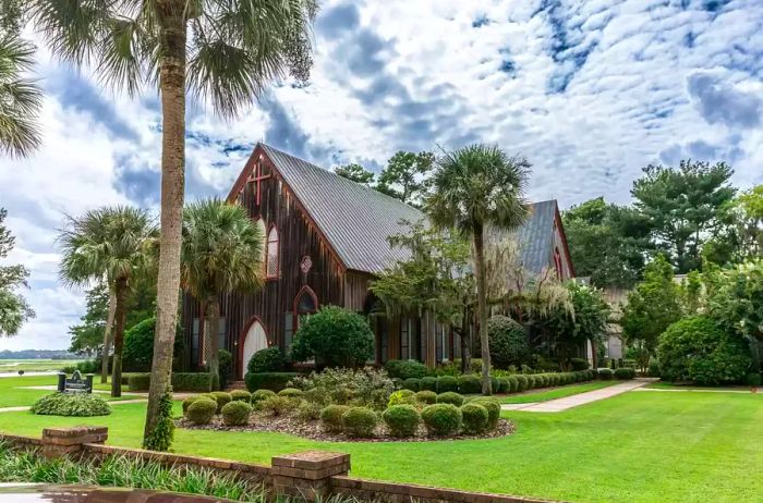 The historic Church of the Cross in Bluffton, South Carolina during daylight.