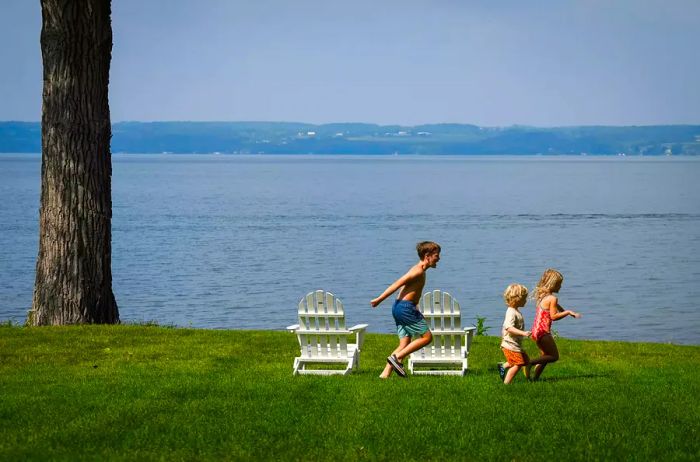 Children play along the shores of Cayuga Lake in Aurora, N.Y.