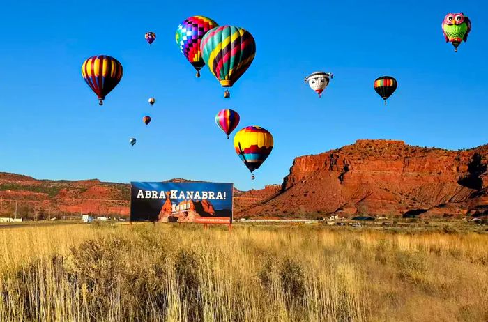 Hot air balloons and a billboard in Kanab, Utah