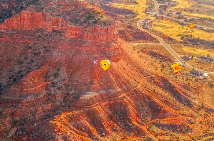 Hot air balloons soaring above K Mountain in Kanab, Utah