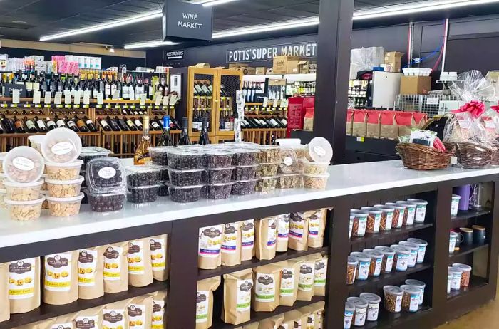 Interior view of Mountain Fresh Grocery showcasing wine and snacks elegantly arranged